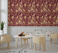 Study room styled with botanical bird wallpaper in burgundy and cream tones