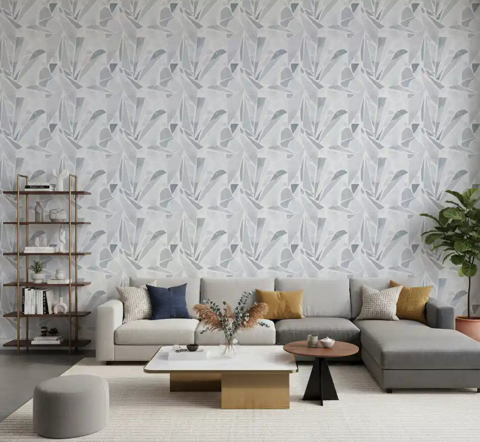 Fragmented gray shapes pepper the living room with Grayscale Mosaic wallpaper.
