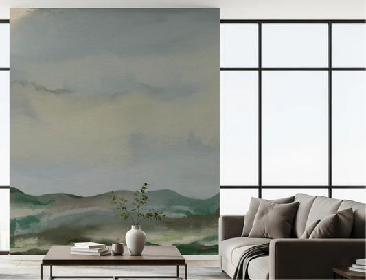 Modern lounge showing painterly hillside wall mural with misty sky tones