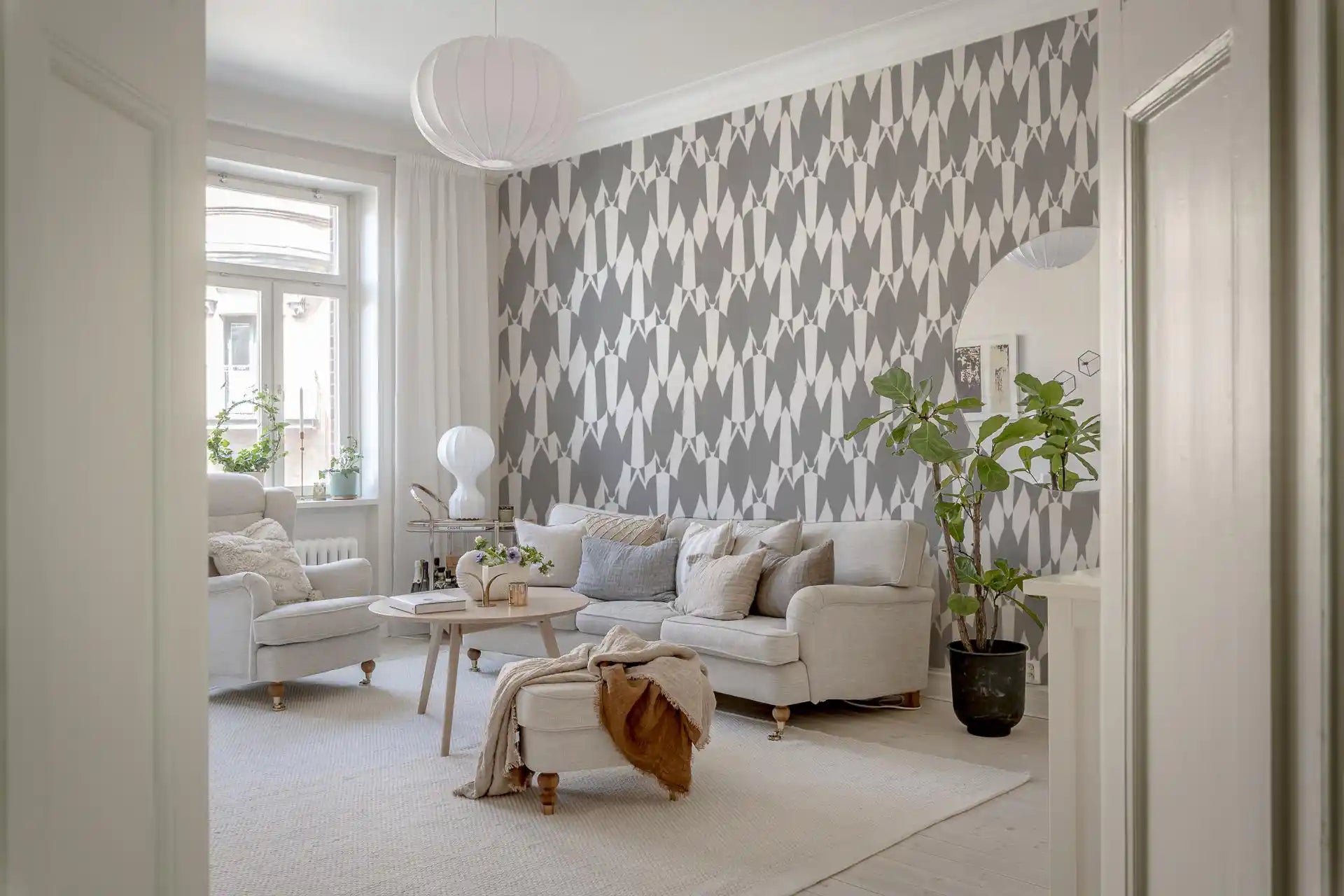 Geometric flow wallpaper featuring elongated teardrop motifs in two tones