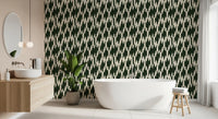 Interlocking crown crest wallpaper framing the bathroom in green and cream