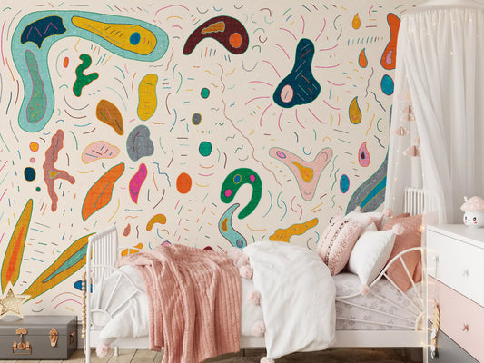 Abstract shapes wall mural in multicolor covering a kids' bedroom

