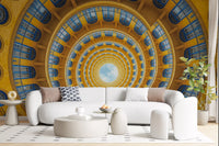 Golden yellow tiers contracting toward a sky opening on the spiral wall mural