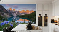 Turquoise lake reflection in the Alpine Glow Lakeside Blooms wall mural at sunrise