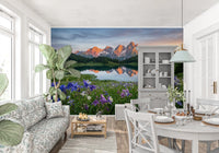 Snow-capped mountain peaks glowing orange in the alpine reflection wall mural