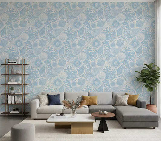 Boho Seashell Coral wallpaper covering a living room in soft blue and cream