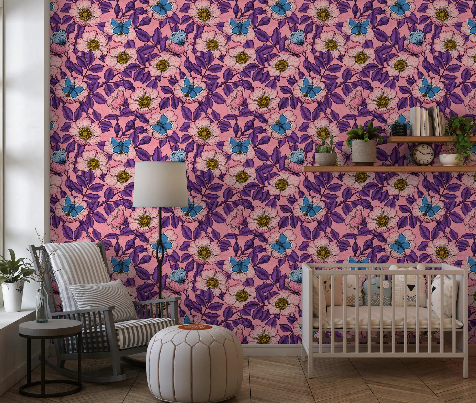 Pink dog rose blooms and blue butterflies layer over purple leaves on this floral wallpaper