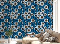 White Daisies on blue Wallpaper covering a modern living room .