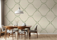Dotted green lattice wallpaper sets a calm tone in this airy dining room
