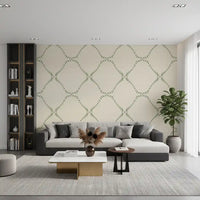 Small green dabs loop into open diamonds across this dotted lattice wallpaper
