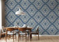 Block print ornament slate blue canvas wallpaper anchors this dining room calmly