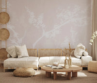 Calm botanical wall mural giving a living room a gentle, hazy neutral backdrop