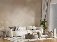 Casual lounge lit by an ethereal misty forest wall mural overhead