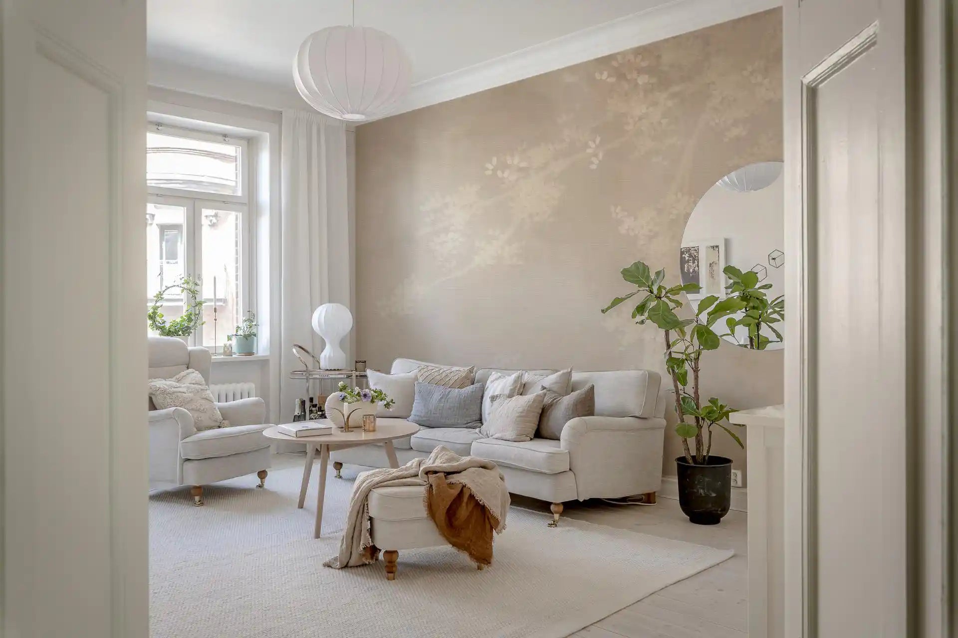 Warm beige and sepia tones give this misty forest wall mural a calm depth