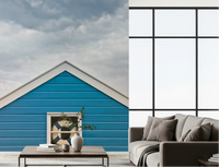 Breezy coastal mood fills a living room with the Blue Beach Hut wall mural