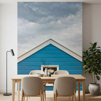 Coastal blue and white tones calm a Dining room in the Beach Hut wall mural