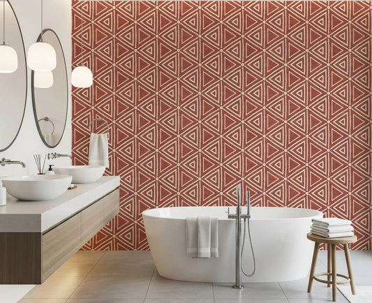 Terracotta mudcloth triangle wallpaper warming a clean bathroom