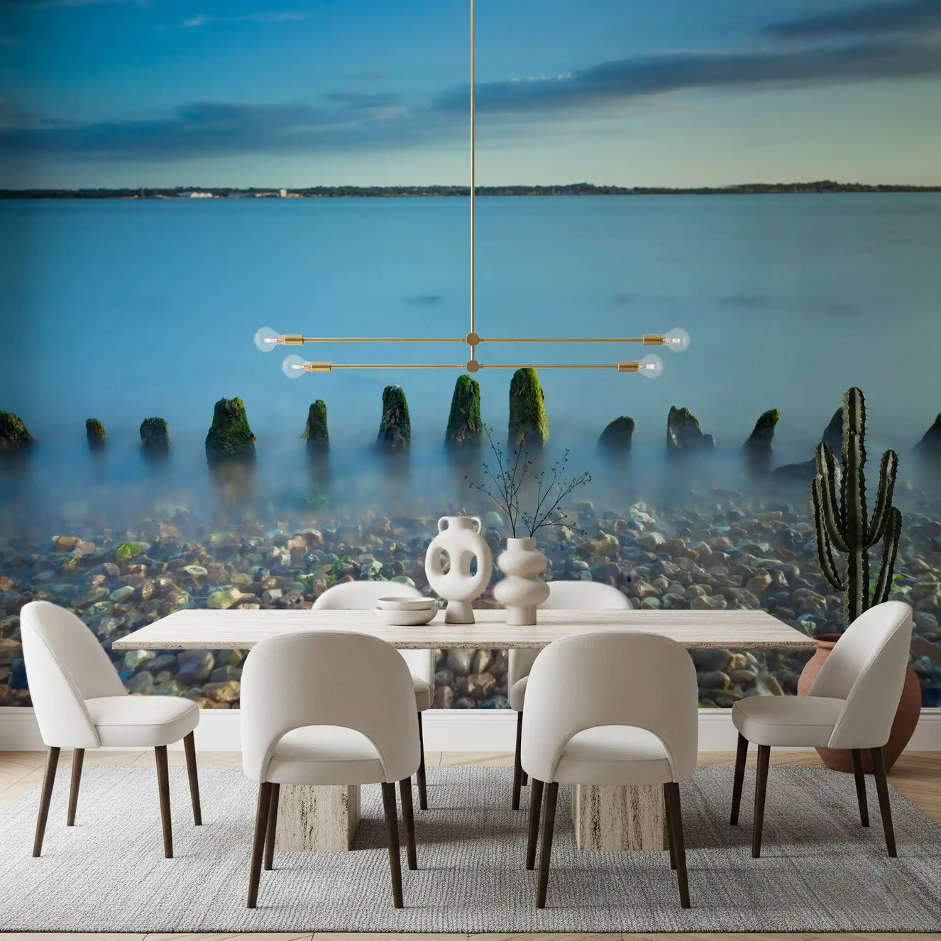 Pebble shore and mossy timbers shape this Dining room Ethereal Coastline wall mural view.