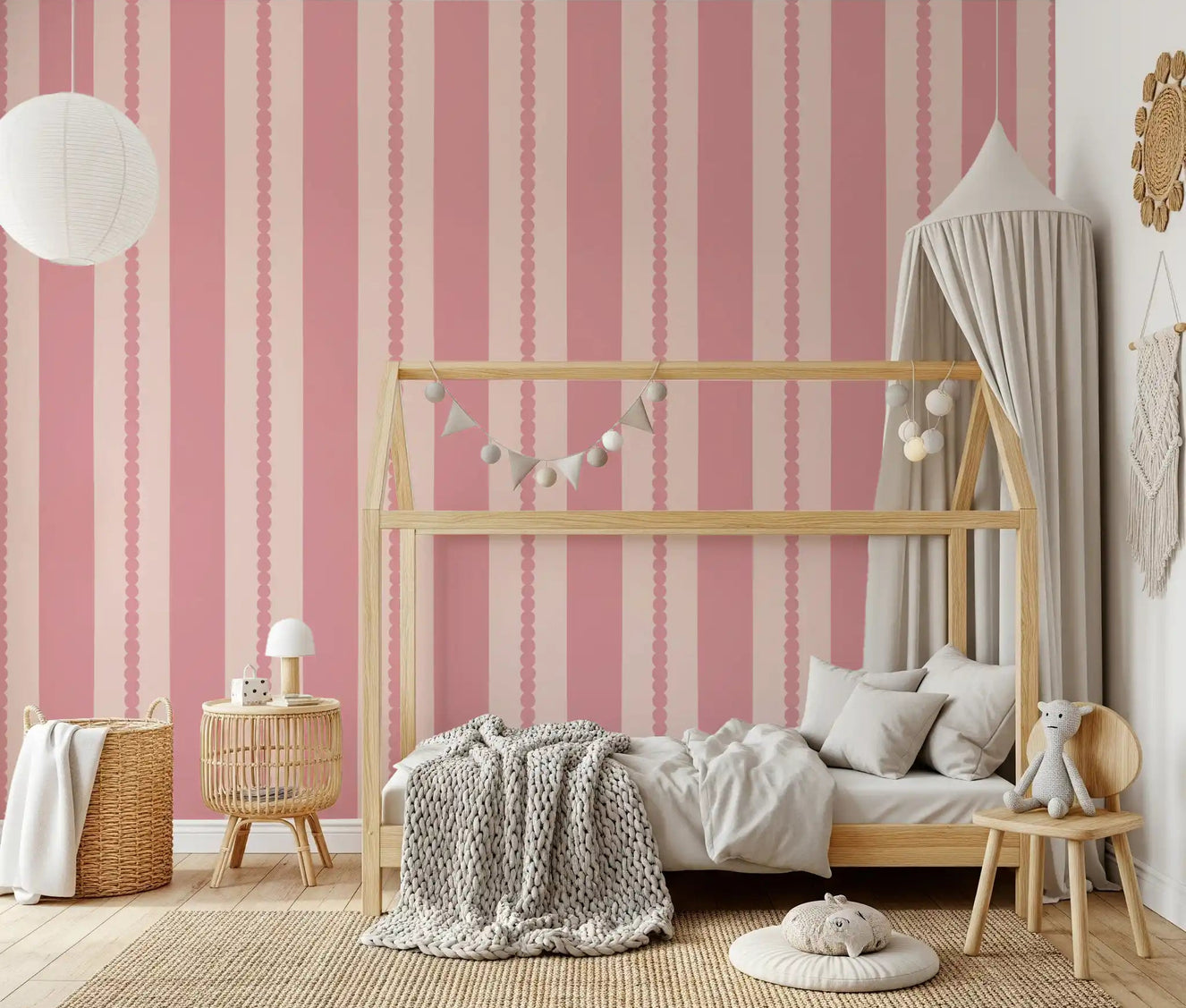 Light hues in the kids room showing the Blush Scallop Stripes Wallpaper surface.