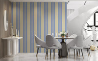 A repeating geometric pattern of light blue lines on this striped wallpaper.