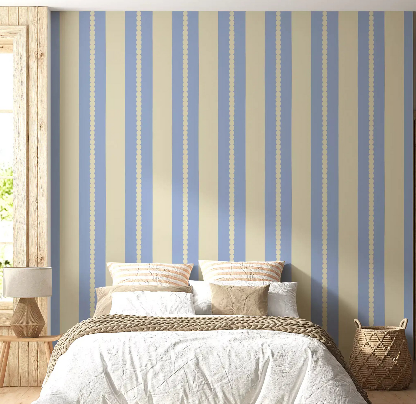 A bedroom features a vertical Scalloped Sky Stripes Wallpaper.