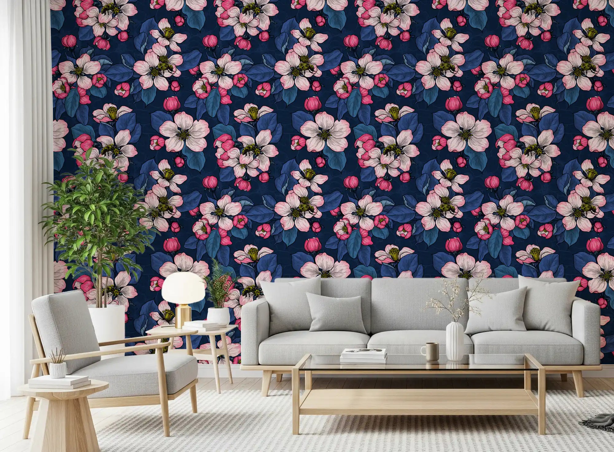Pink flowers stretch across the Apple blossom on dark blue wallpaper in this living room.