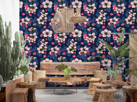 Navy backdrops contrast against light flora on this detailed apple wallpaper.