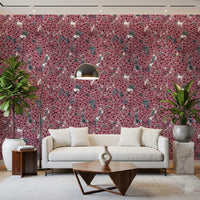 A bright Living room utilizes the bold botanical Pink Lilac wallpaper for depth.