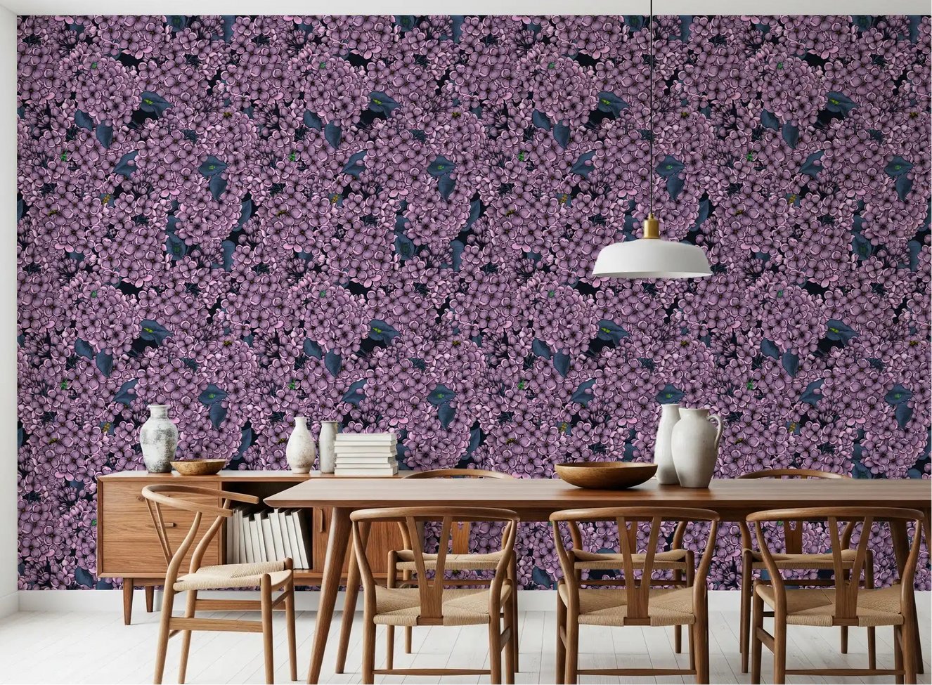 The Violet Lilac garden wallpaper creates a moody feature in this Dining room.