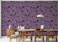 The Violet Lilac garden wallpaper creates a moody feature in this Dining room.