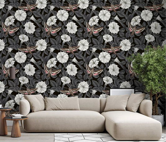 Neutral tones highlight the Moonflowers and sphinx moths wallpaper in this living room.