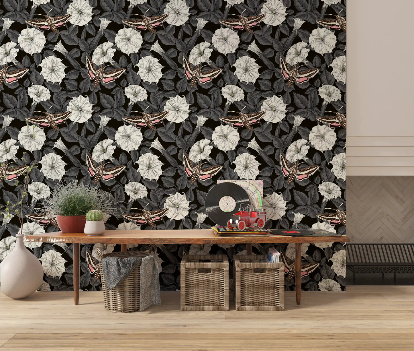 White moonflowers pop against the dark Moonflowers and sphinx moths wallpaper.