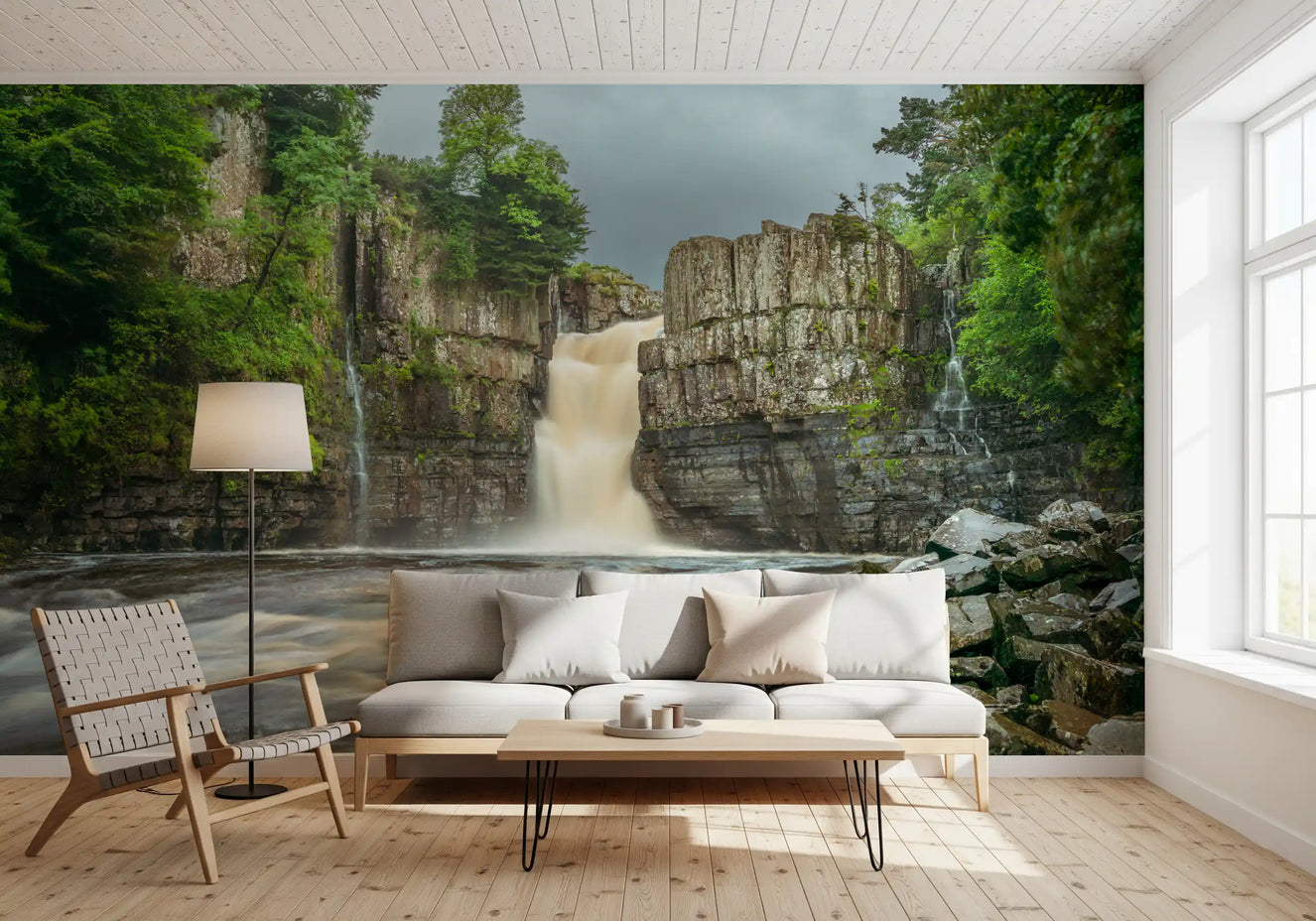 Emerald Falls Serenity Wall Mural creates a lush in a modern living room.