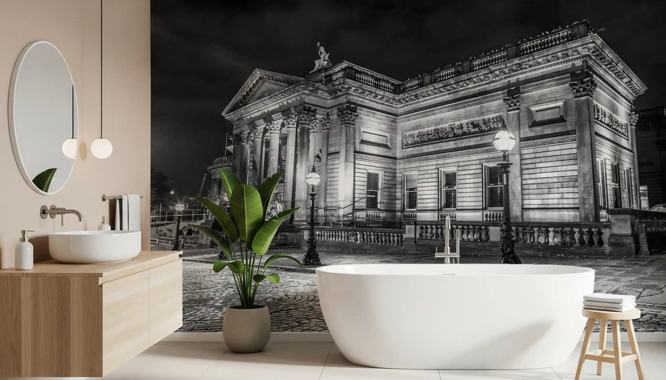 A sleek freestanding tub sits near the Classical Nightscape wall mural in this bathroom.