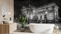 A sleek freestanding tub sits near the Classical Nightscape wall mural in this bathroom.