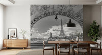 Stone arch framing the Eiffel Tower fills the Parisian Vista wall mural over a Dining room.