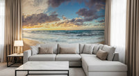 Golden Serenity wall mural opens a tidal scene over the lounge with surf and sand tones.