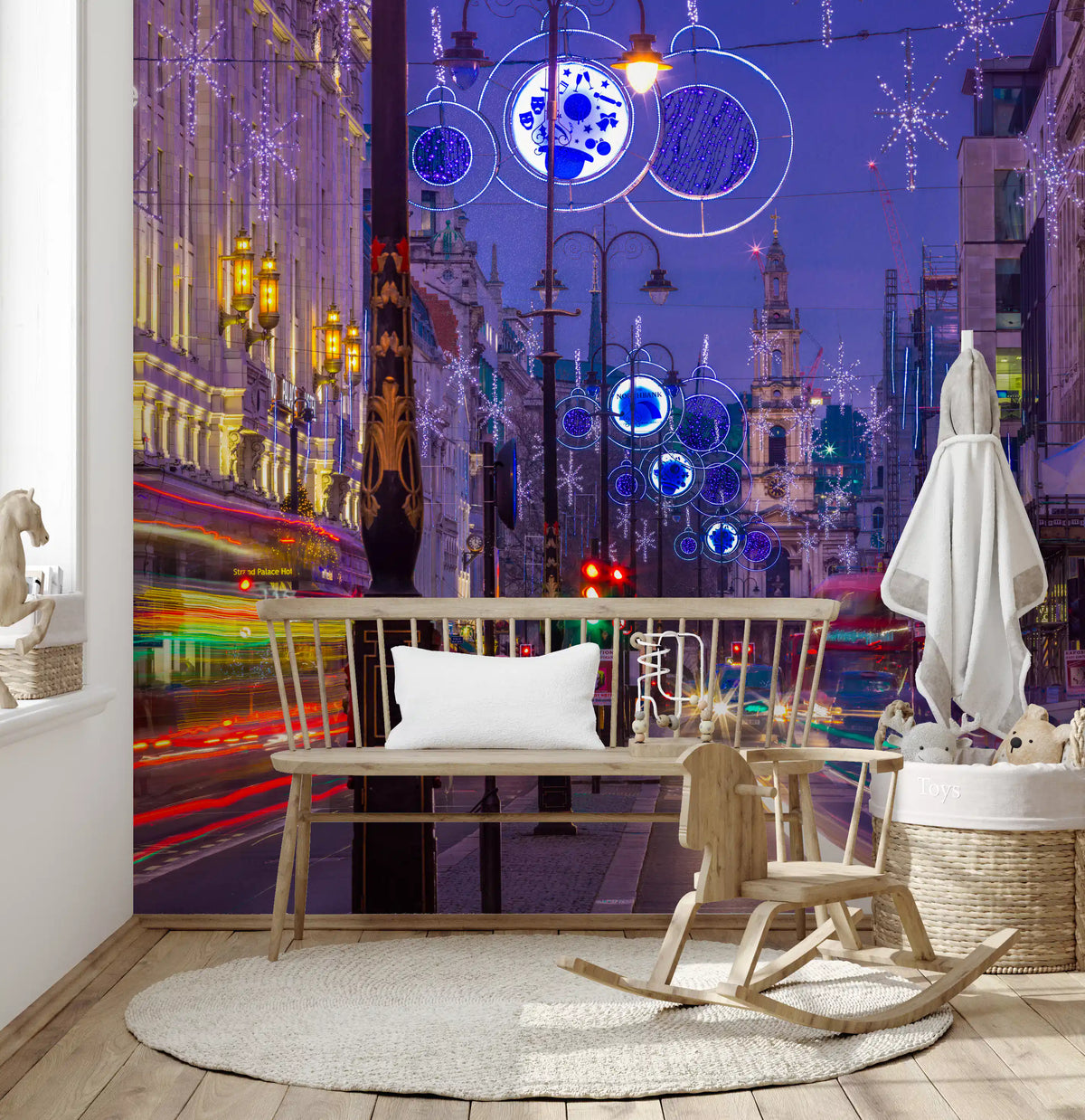 Twilight glow from Night Lights & City Trails wall mural fills this Nursery area corner.