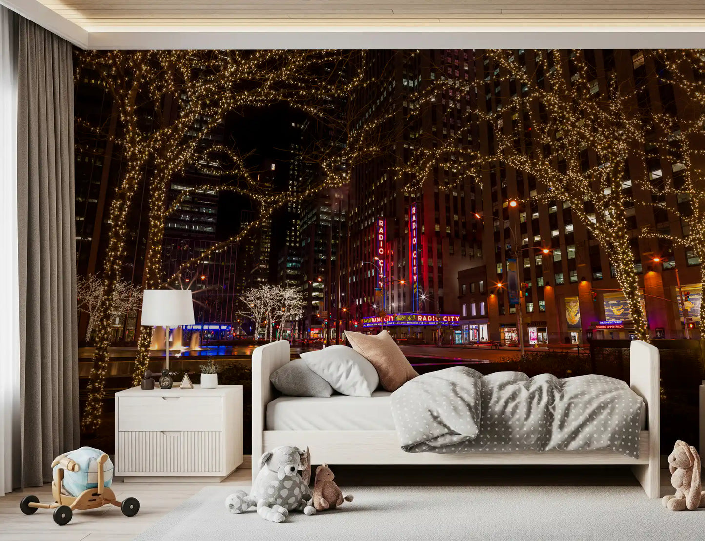 Bare-branch fairy lights warm a Kids bedroom with the Radio City Night Glow wall mural