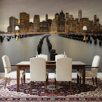 Pale dusk sky in the NYC Urban Glow wall mural covers a lit Manhattan front