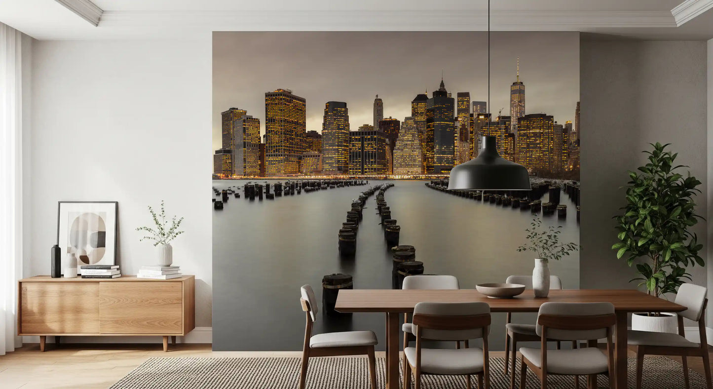 Manhattan's lit horizon reaches into a Dining room through the NYC Urban Glow wall mural
