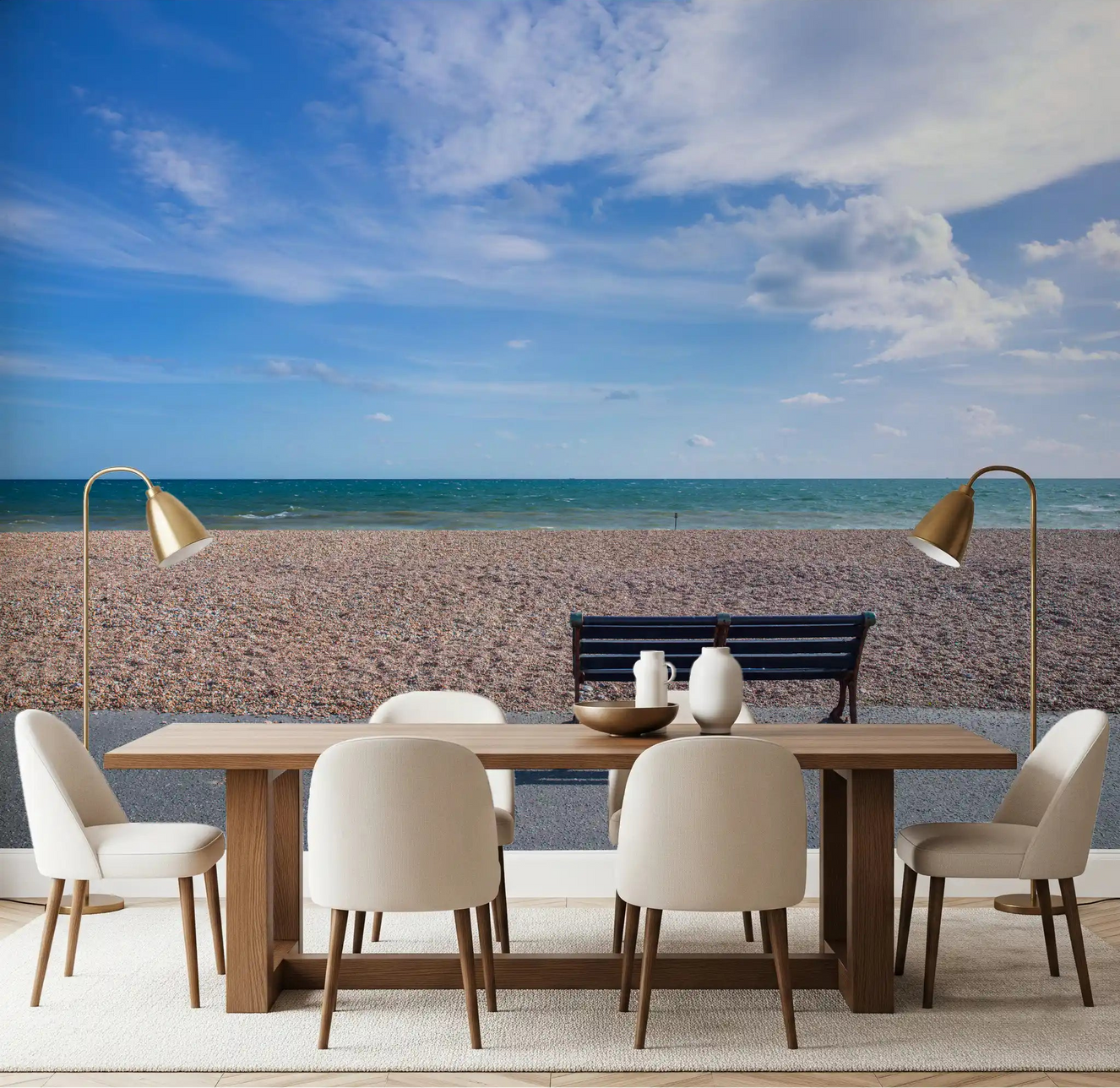 Pale pebbles and quiet sea fill the Blue Horizon wall mural across a dining room