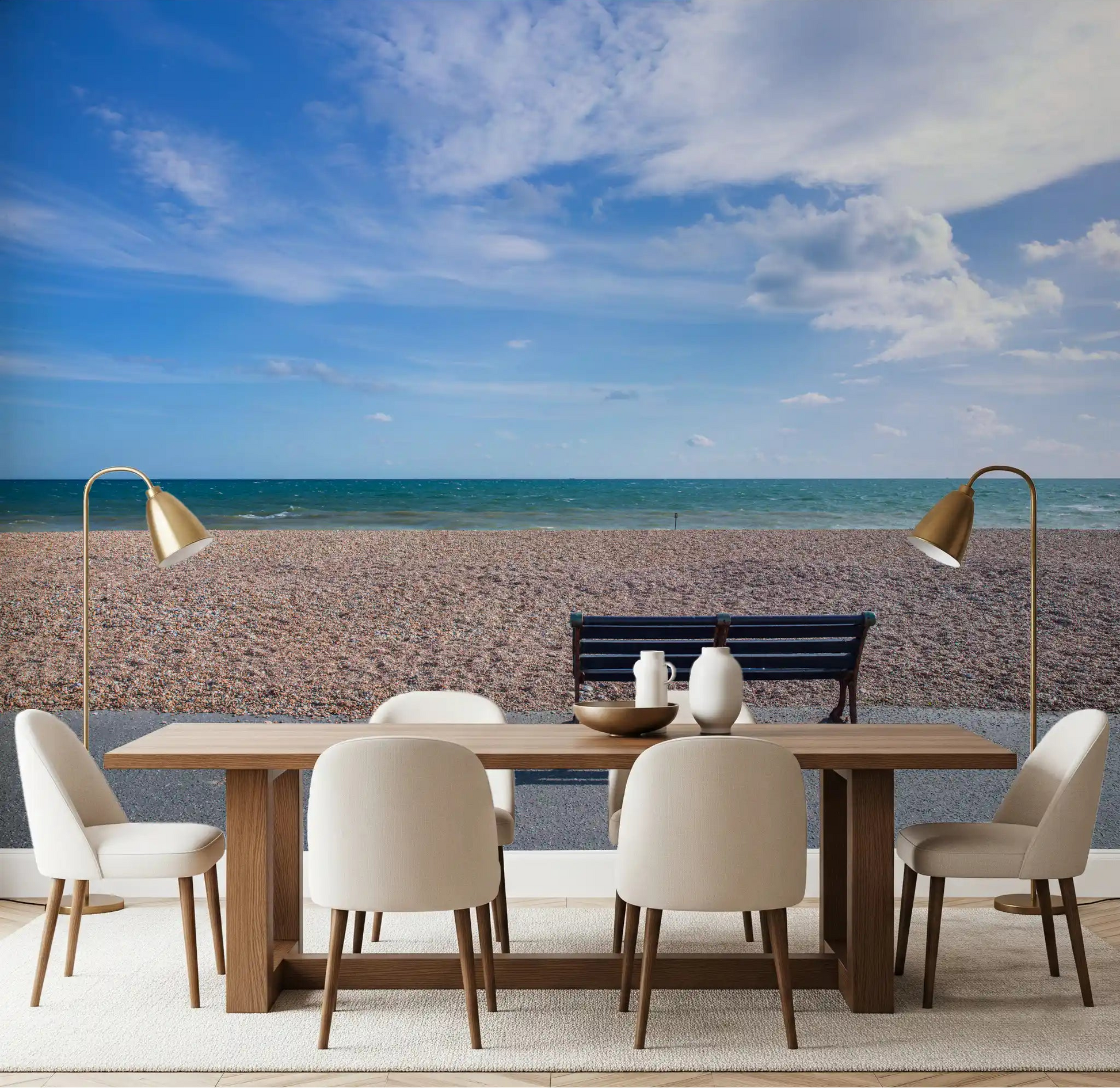 Pale pebbles and quiet sea fill the Blue Horizon wall mural across a dining room