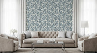 Slate sprigs and indigo stems frame a Living room the Coraline wallpaper repeat