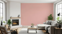 Blush pink repeat pattern wallpaper on a living room wall
