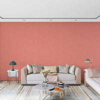 Linen weave wallpaper in coral on a modern living room accent wall