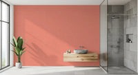 Bathroom featuring textured coral wallpaper with subtle surface grain