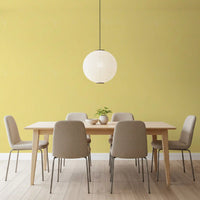 Dining room with Butter Yellow Linen wallpaper and soft textured finish
