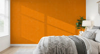 Bedroom styled in modern orange wallpaper with gentle fabric texture