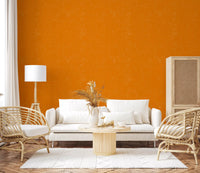 Warm orange wallpaper with a fabric-inspired finish and subtle structure